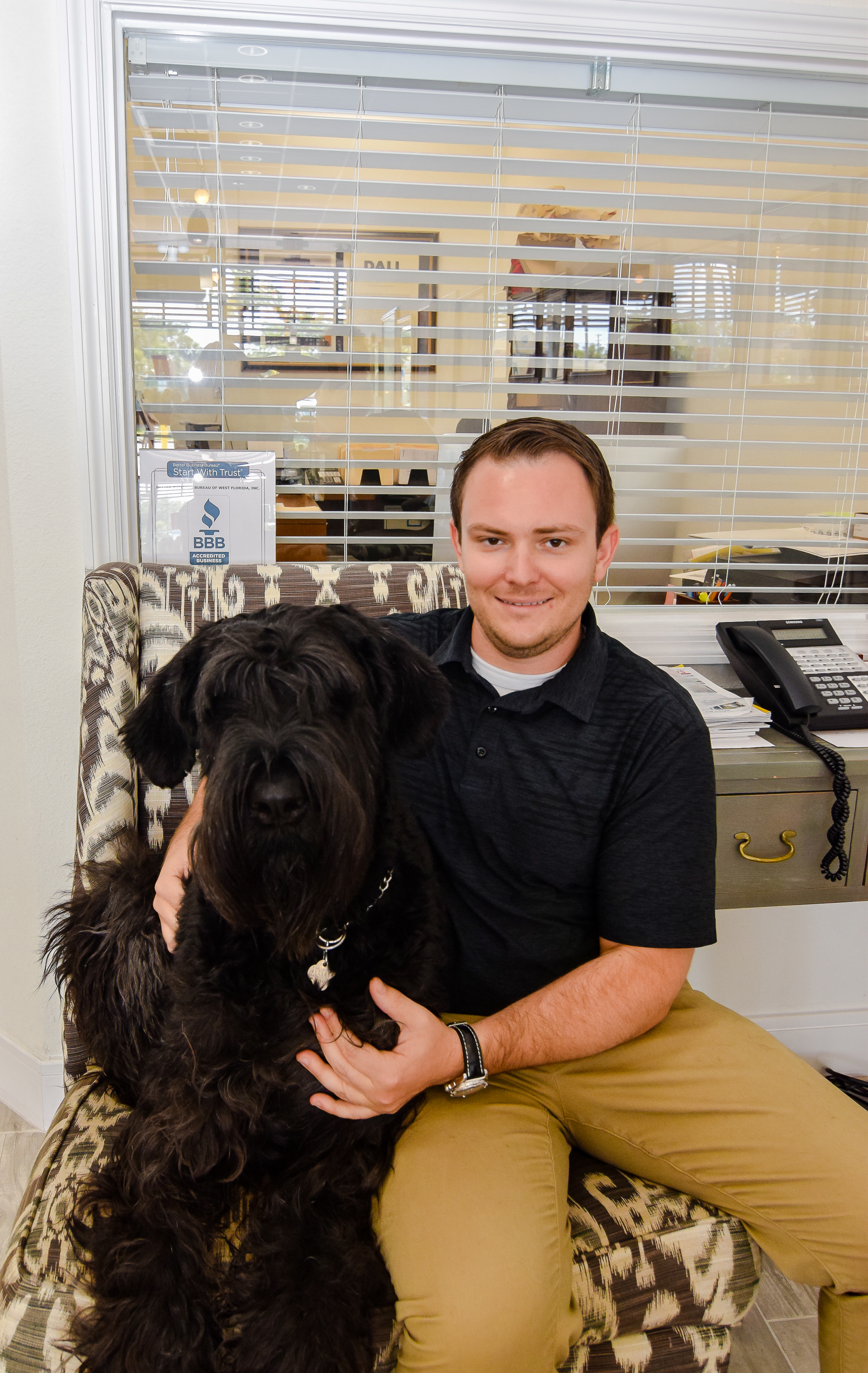 Victor Cappello, shown here with his Giant Schnauzer, Bruno, who is a regular in the shop