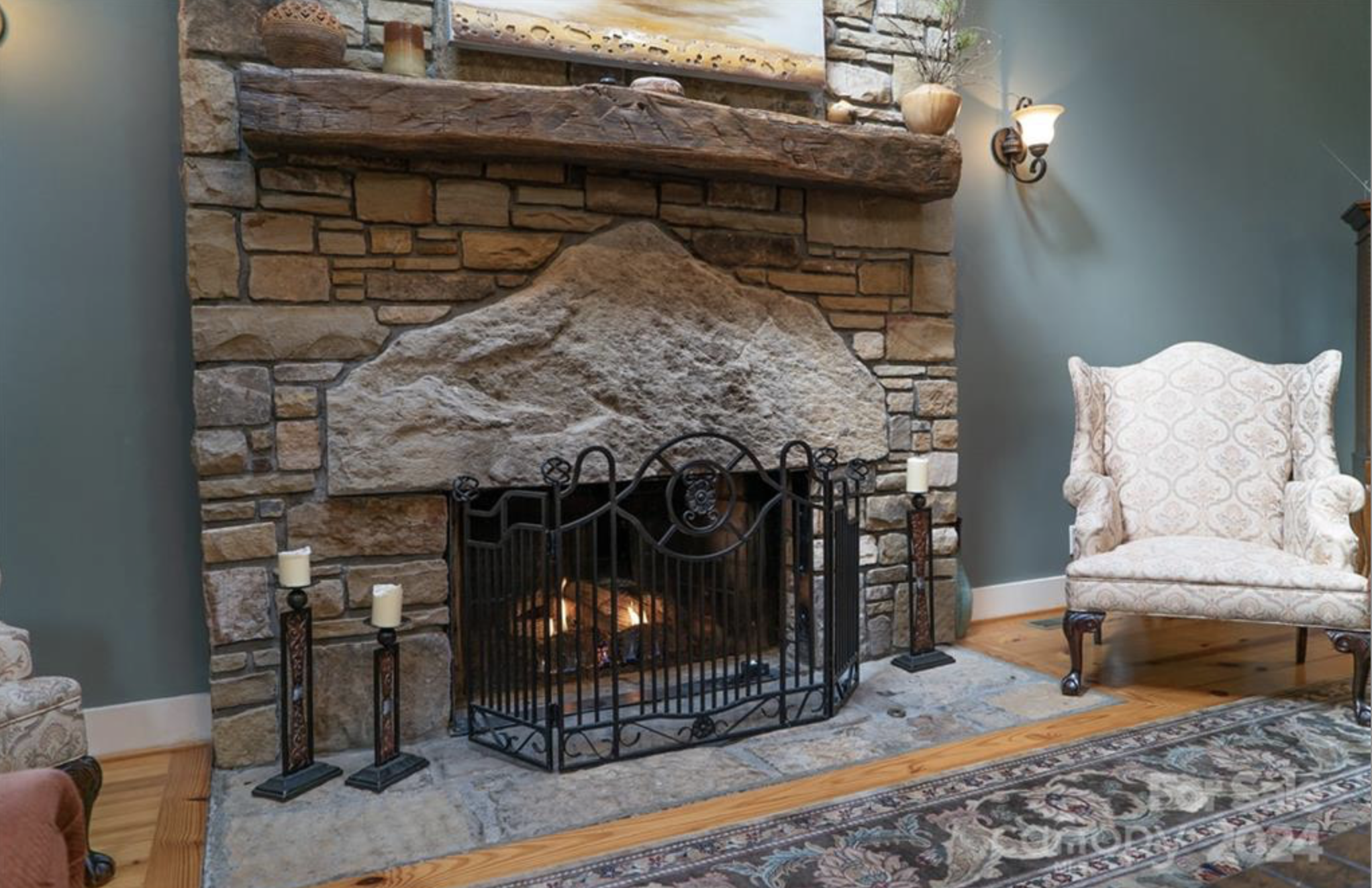 living room with fireplace and chairs