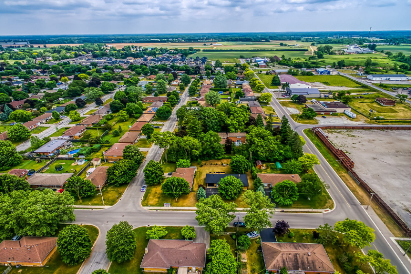 large kitchen with center island surrounded by bar stools