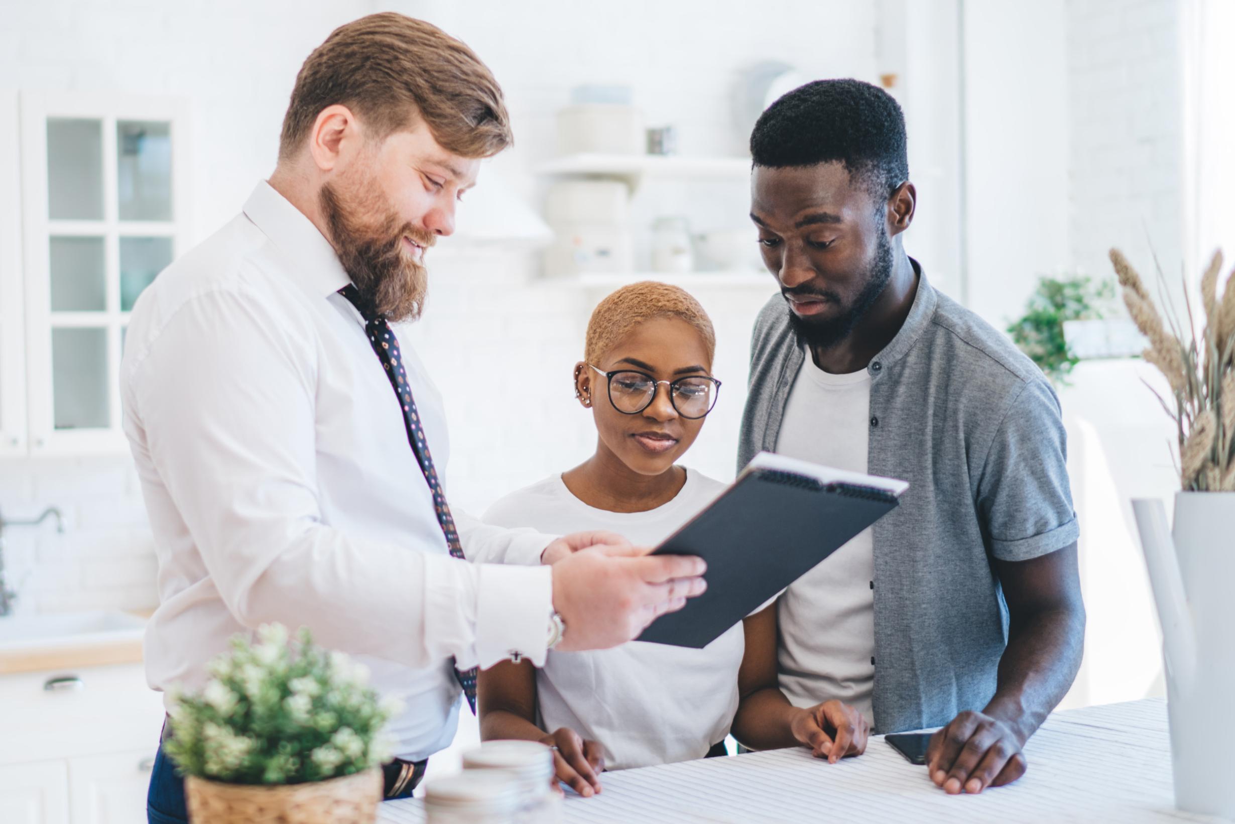 people meeting with real estate agent