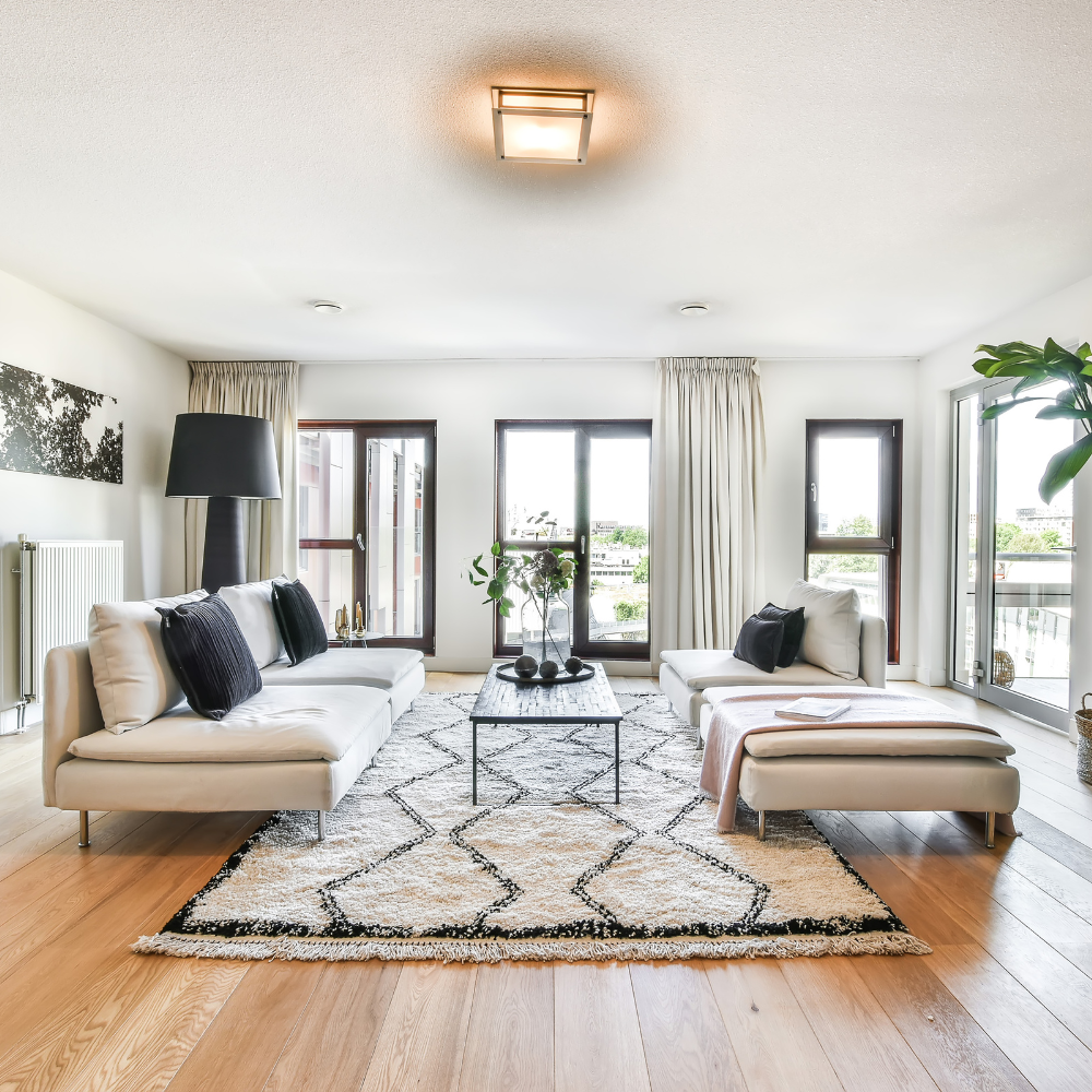 front living room with overhanging lamp and gray couch