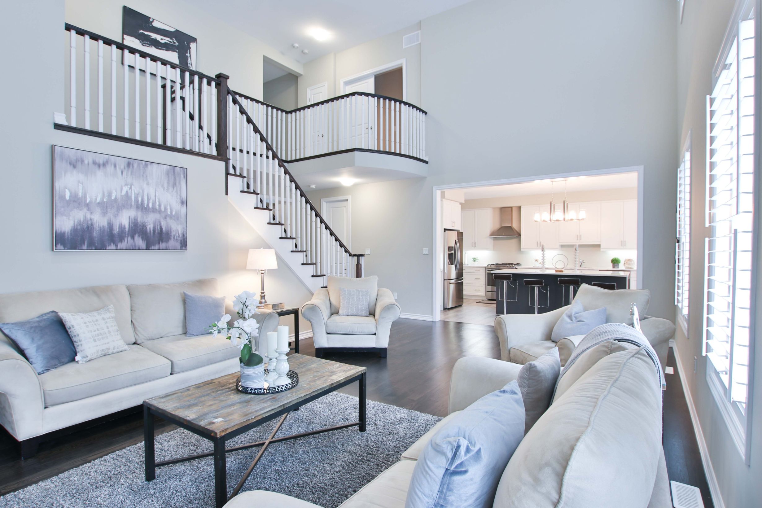  large living room with wood floors and steps to kitchen
