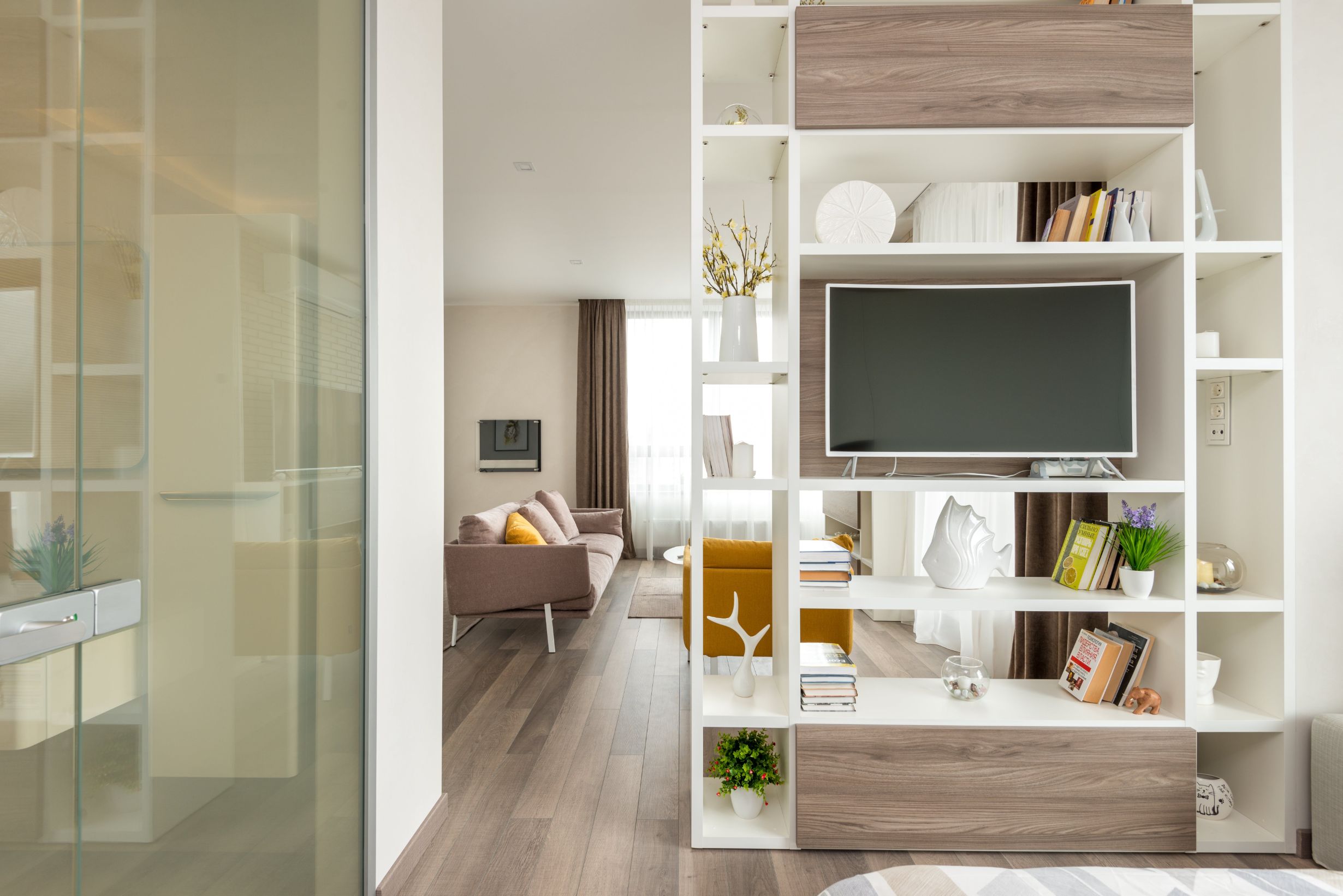 large living room with wood floors and steps to kitchen