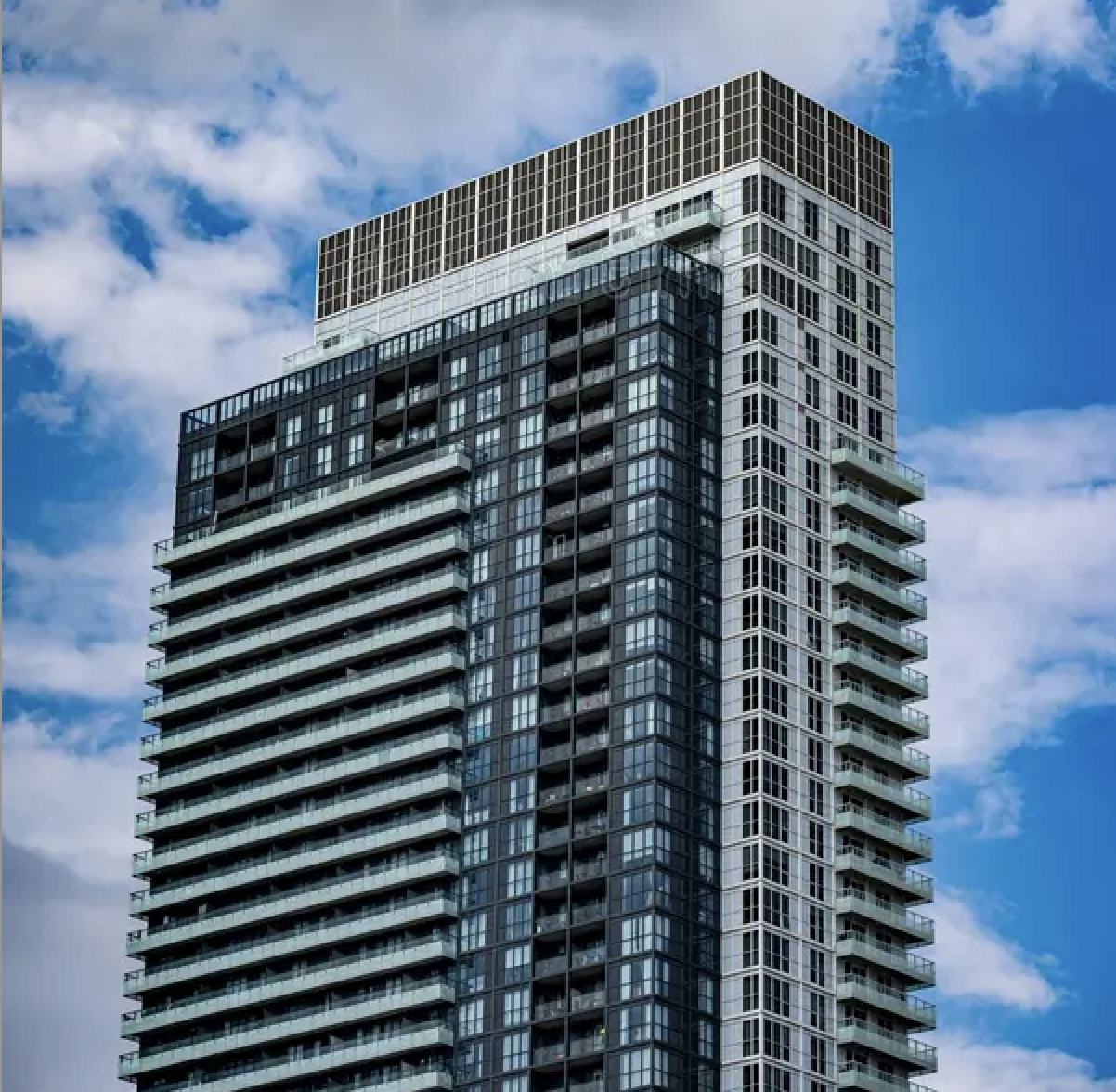 front of condo building with brick walls