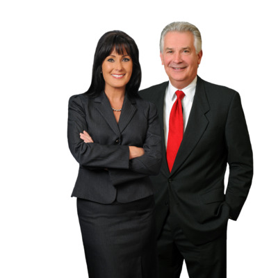 man and woman holding boxes