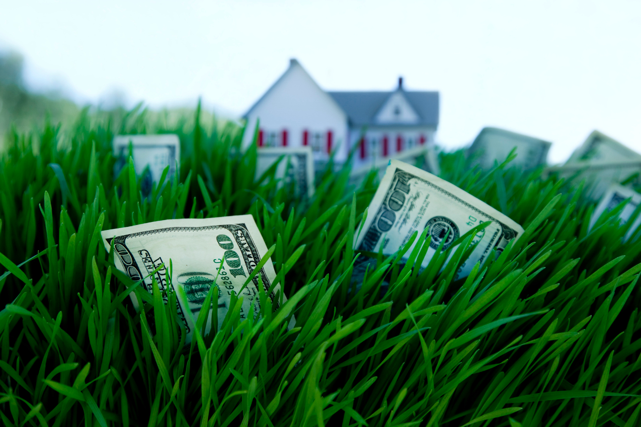graphic of hand holding miniature house