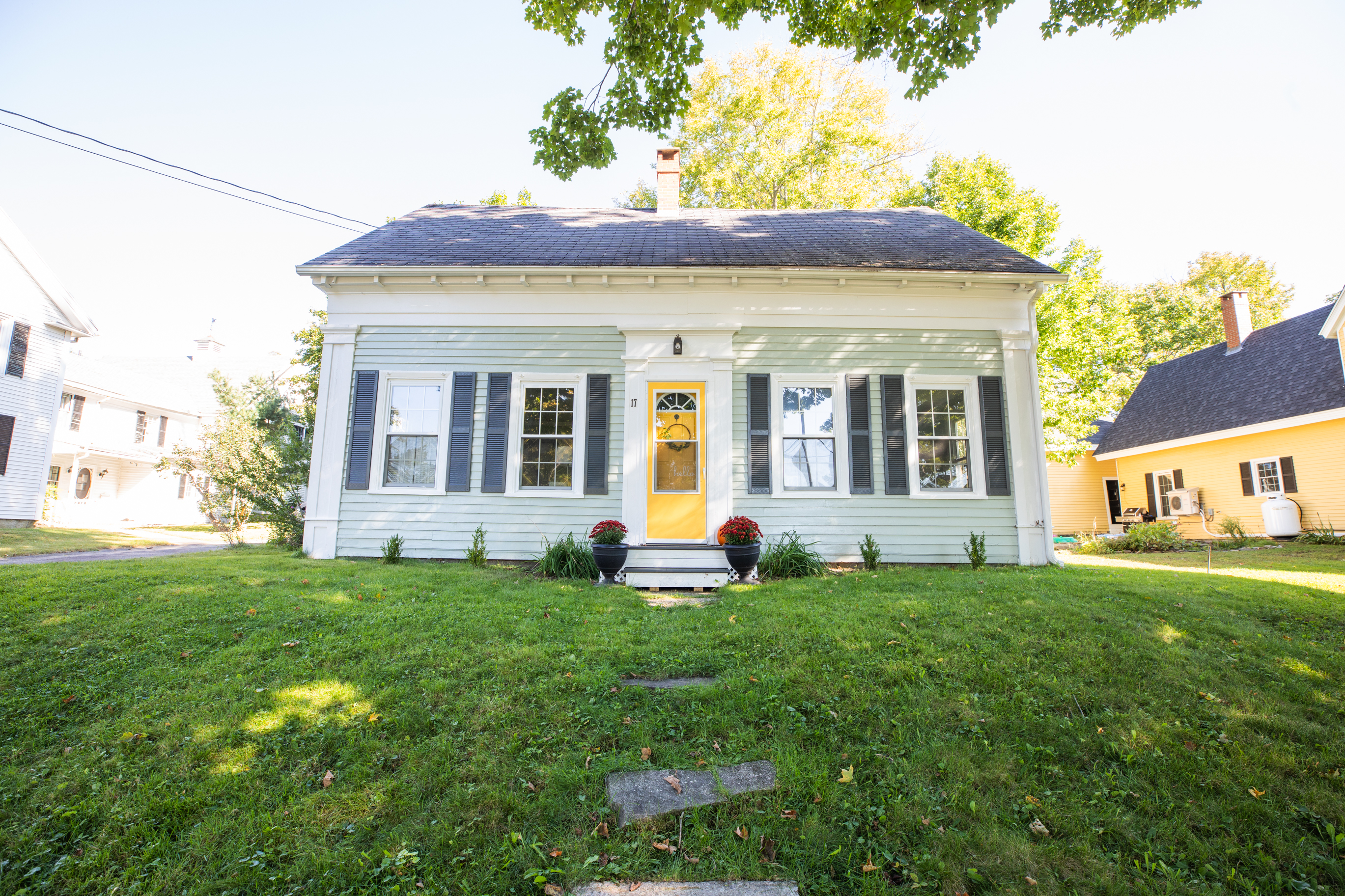 graphic of hand holding miniature house