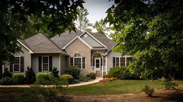 graphic of hand holding miniature house